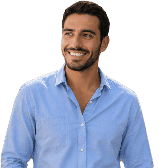 A man with dark hair and a beard, wearing a light blue button-up shirt, smiles and looks to his left against a plain light background.